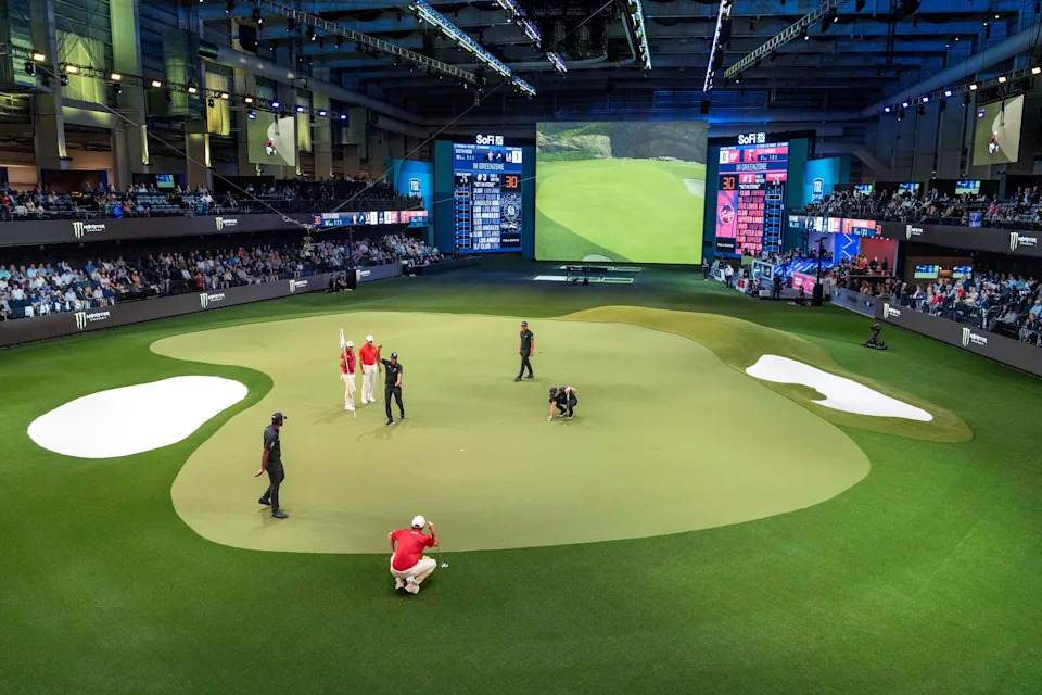 Golfers line up their shots on the green at SoFi Center during golf match between Jupiter Links and Los Angeles Golf Club in the TGL on January 14, 2025 in Palm Beach Gardens, Florida.