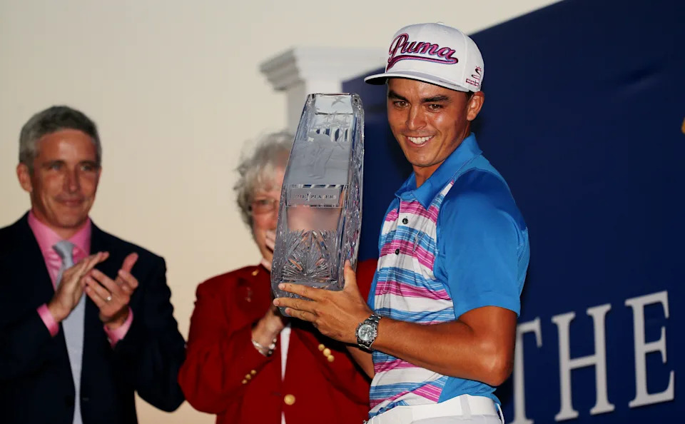 Rickie Fowler celebrates with the winner's trophy after the final round of THE PLAYERS Championship at the TPC Sawgrass Stadium course on May 10, 2015 in Ponte Vedra Beach, Florida.