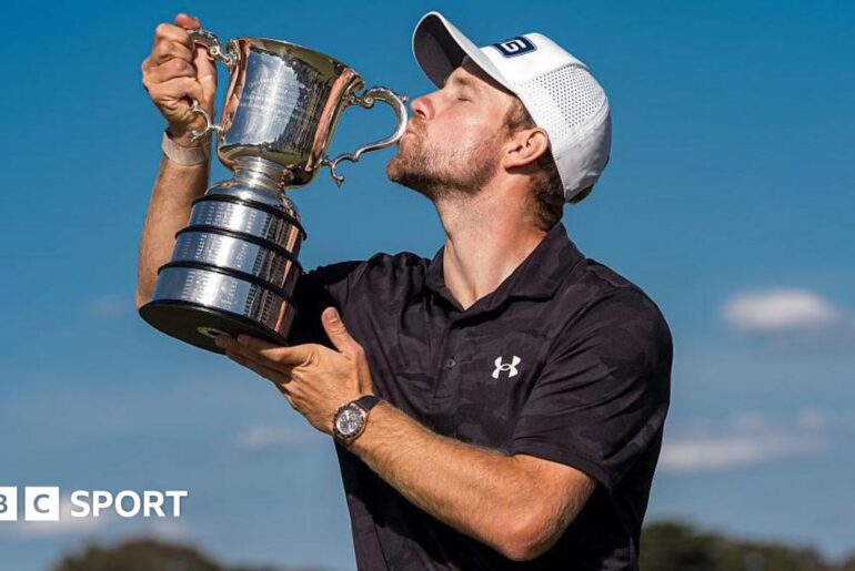 Neergaard-Petersen kisses the Australia Open trophy