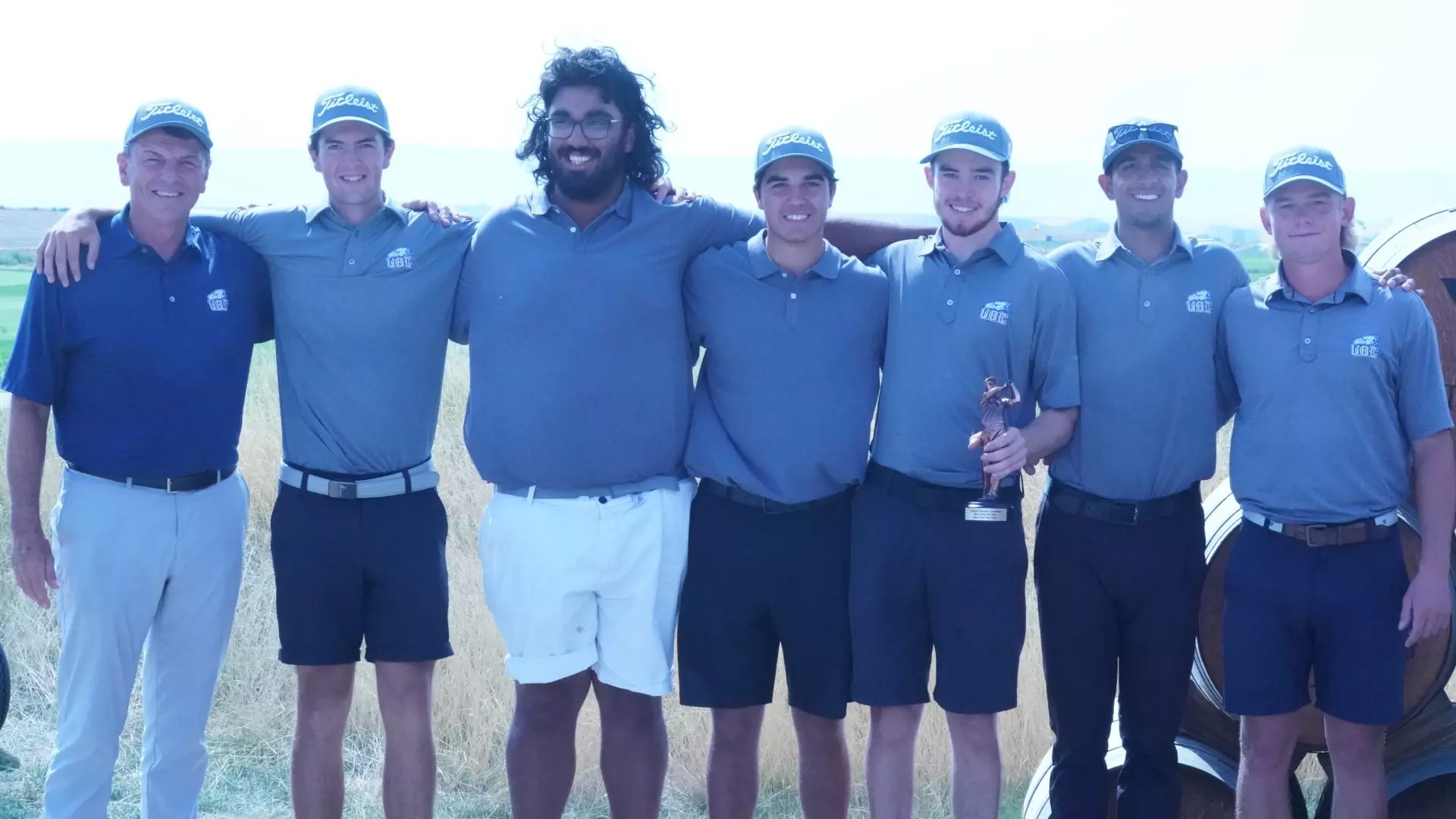 UBC Thunderbirds men's golf smiling and posing with a trophy after winning the 2025 Wine Valley Invitational, hosted by Walla Walla University