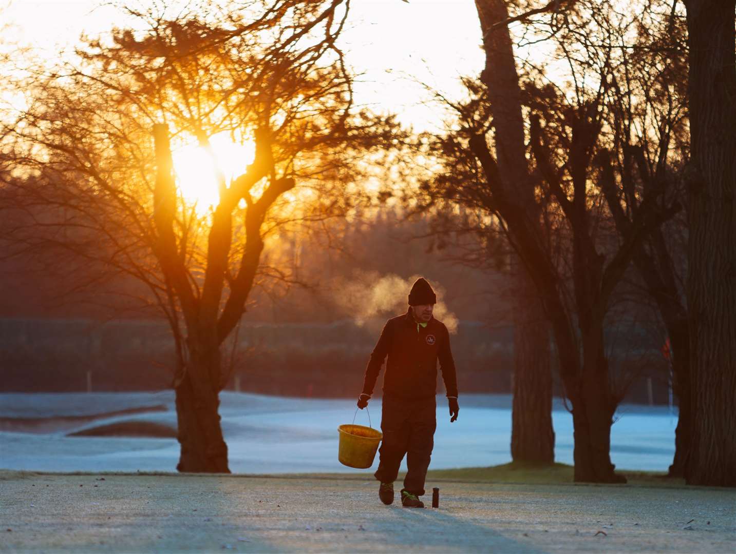 Greenkeeper Nick Brewster tackles the wintry conditions Picture: Dan Cole