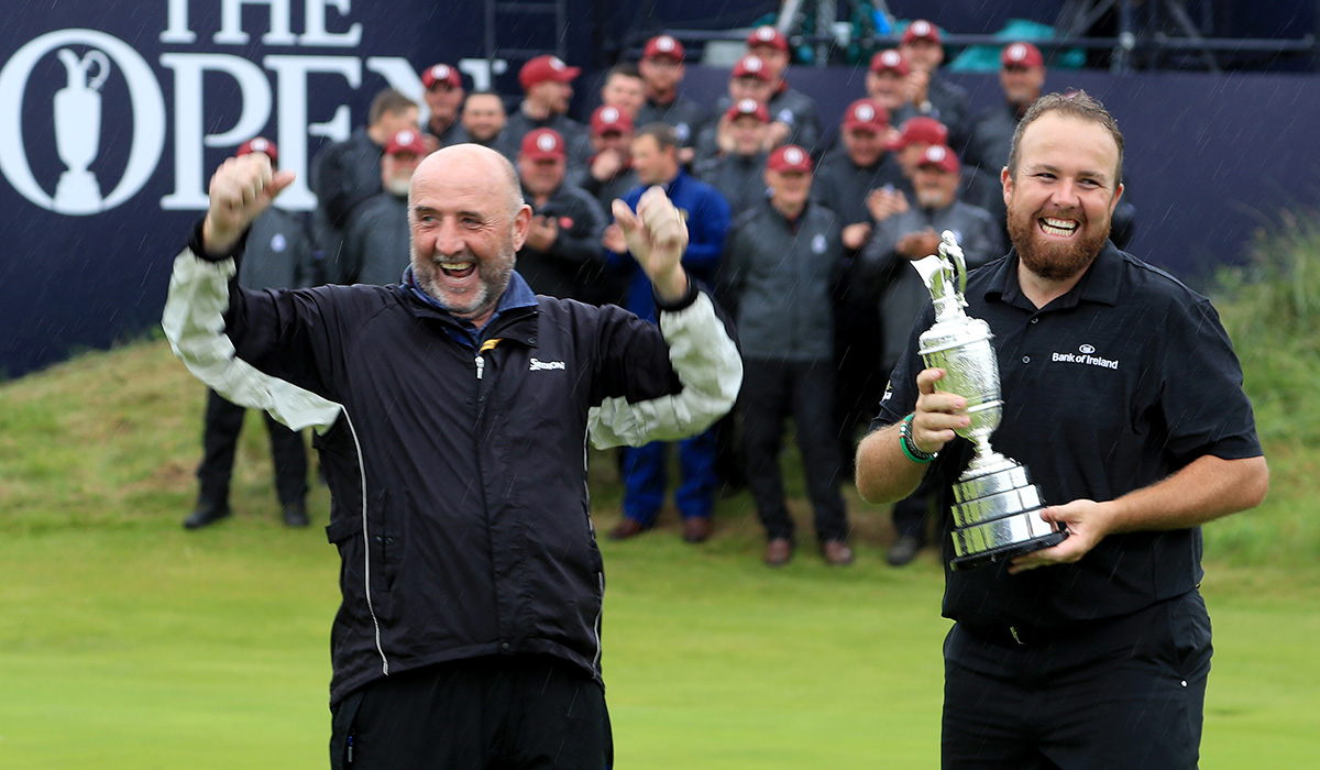 PORTRUSH, NORTHERN IRELAND - JULY 21: Shane Lowry of Ireland holds the Claret Jug as his father Brendan Lowry celebrates after his son's victory during the final round of the 148th Open Championship held on the Dunluce Links at Royal Portrush Golf Club on July 21, 2019 in Portrush, United Kingdom. (Photo by David Cannon/Getty Images)