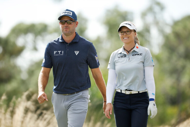 NAPLES, FLORIDA - DECEMBER 09: Corey Conners of Canada and Brooke M. Henderson of Canada walk from the second tee during the second round of the Grant Thornton Invitational at Tiburon Golf Club on December 09, 2023 in Naples, Florida. (Photo by Cliff Hawkins/Getty Images)