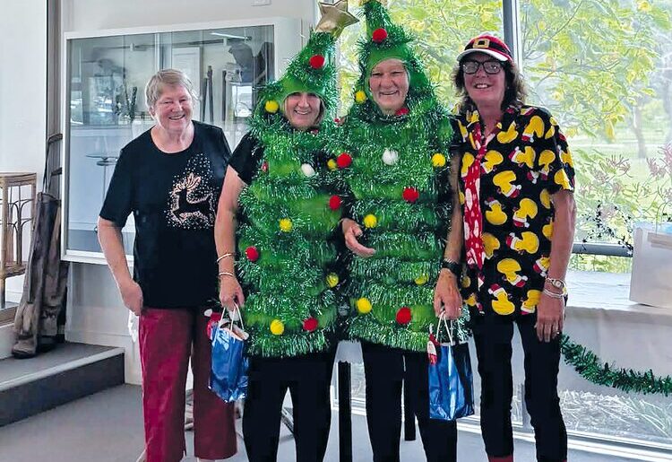 Christmas spirit is alive and well at the Lakes Entrance Golf Club with members Jenny Dowie and Di Gray recently dressing up as Christmas trees for a round. They are pictured with Anita Bertram and Sandi East. (PS)