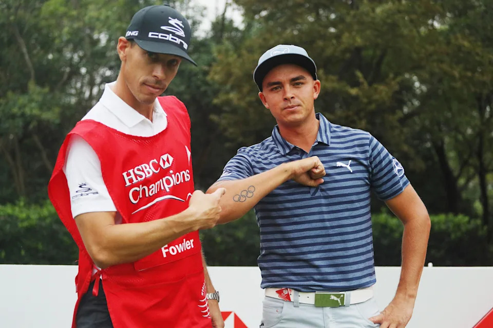 Joe Skovron, caddie for Rickie Fowler, points to his Olympic Rings tattoo during a practice round prior to the start of the WGC - HSBC Champions at the Sheshan International Golf Club on October 26, 2016 in Shanghai, China.