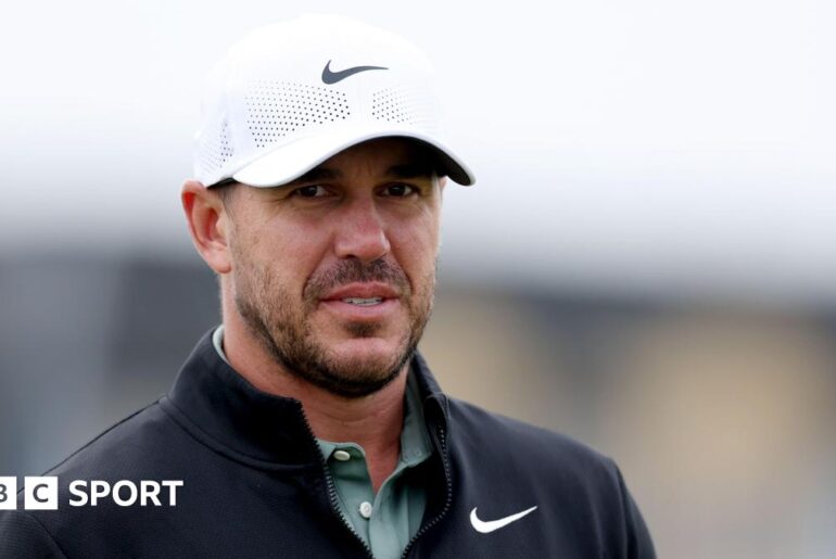 Brooks Koepka looks towards a green