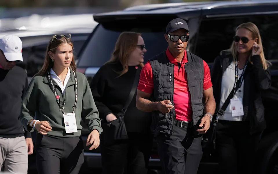 Kai Trump (L) and Tiger Woods arrive to the course during the final round of The Genesis Invitational 2025