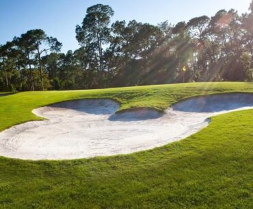 A Mickey-shaped sand trap on a Disney World golf course