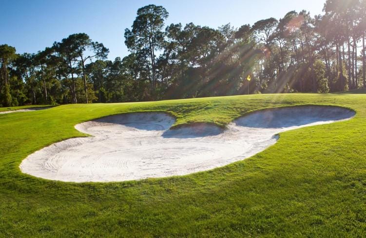 A Mickey-shaped sand trap on a Disney World golf course