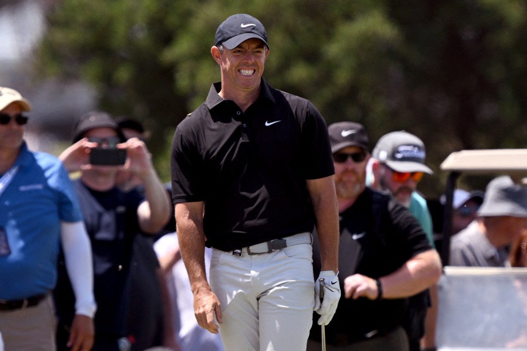 Rory McIlroy reacts during the second round of the Australian Open golf tournament at the Royal Melbourne Golf Club in Melbourne on December 5, 2025. 