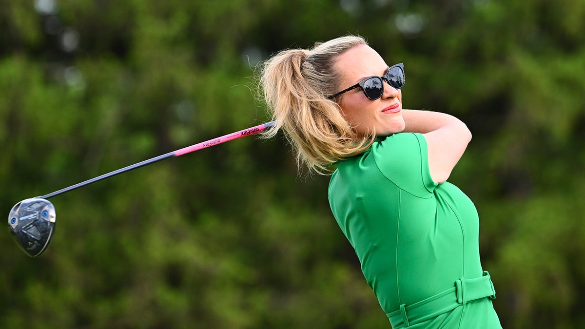 Paige Spiranac hits a tee shot