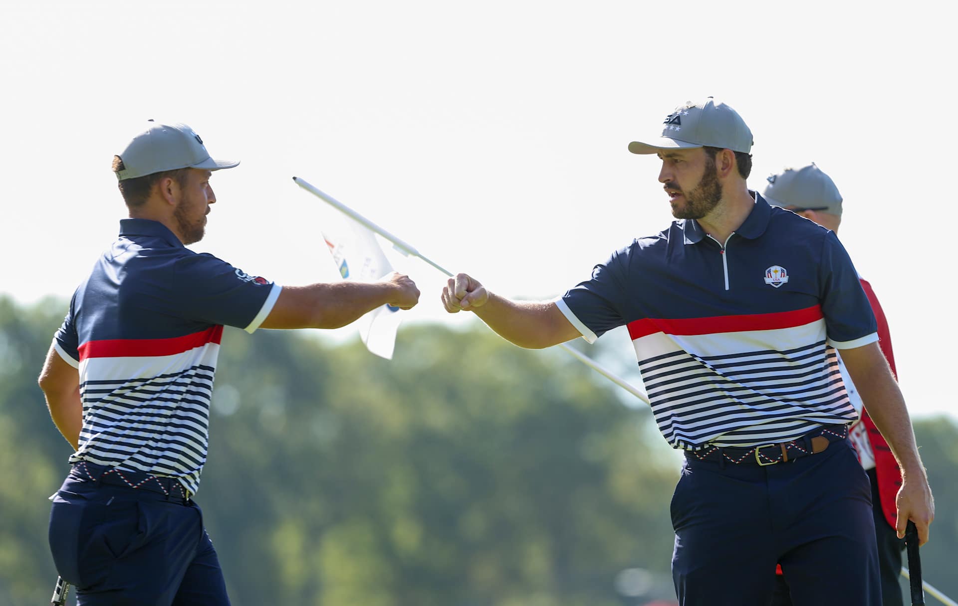 FARMINGDALE, NEW YORK - SEPTEMBER 26: Xander Schauffele fist bumps teammate Patrick Cantlay of Team United States during the Friday morning foursomes matches of the 2025 Ryder Cup at Black Course at Bethpage State Park Golf Course on September 26, 2025 in Farmingdale, New York. (Photo by Jamie Squire/Getty Images)