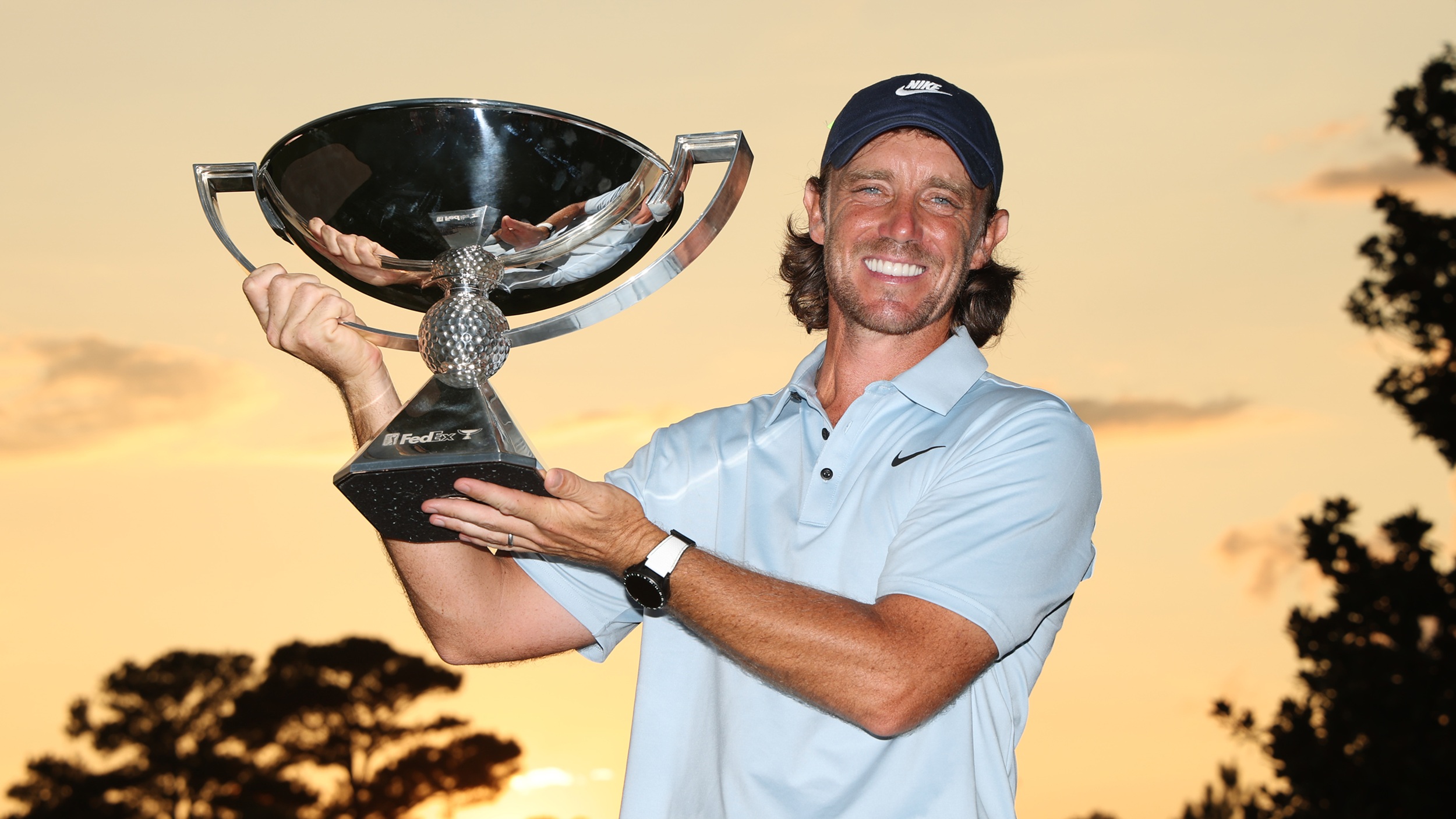 Tommy Fleetwood with the FedEx Cup