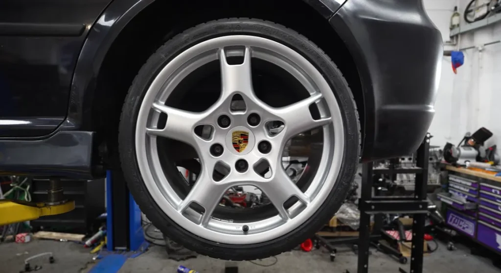 A YouTuber buys a $1,065 Volkswagen Golf to redo the disastrous build he attempted at 17, this time with the Porsche wheels and brakes he always wanted