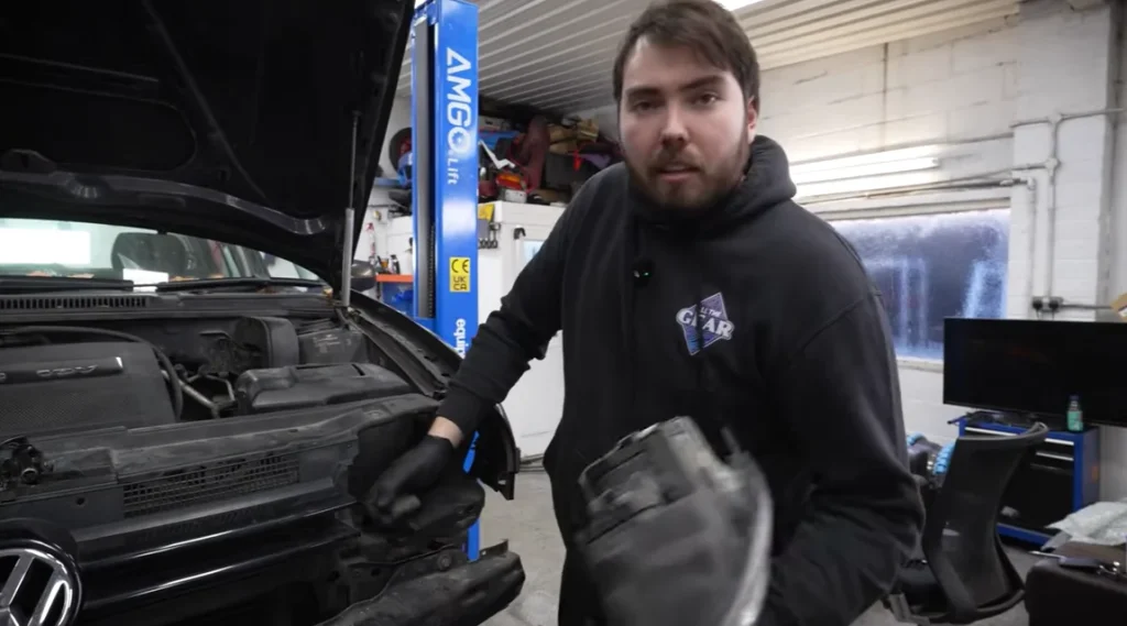 A YouTuber buys a $1,065 Volkswagen Golf to redo the disastrous build he attempted at 17, this time with the Porsche wheels and brakes he always wanted