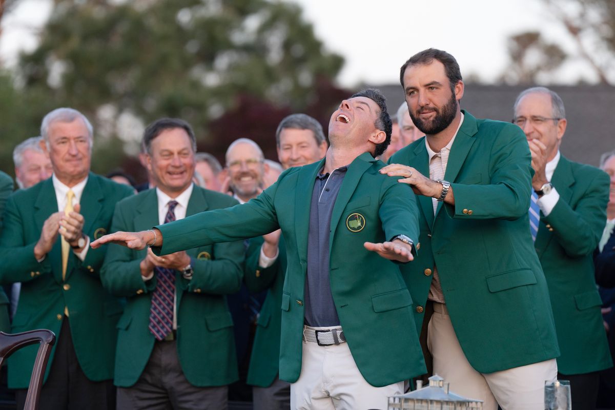 Golf: The Masters: Rory McIlroy victorious, receiving a green jacket from Scottie Scheffler after winning sudden death playoff round to win the tournament on Sunday at Augusta National.
Augusta, GA 4/13/2025
CREDIT: Erick W. Rasco (Photo by Erick W. Rasco/Sports Illustrated via Getty Images)
(Set Number: X164712 TK4 )