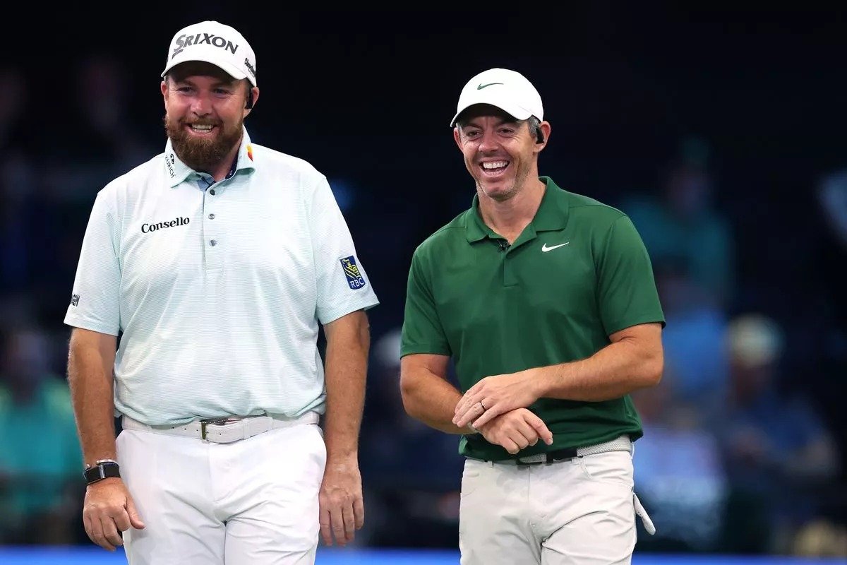 Shane Lowry and Rory McIlroy smile during a TGL match