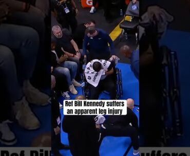 Bill Kennedy exits the game in a wheelchair