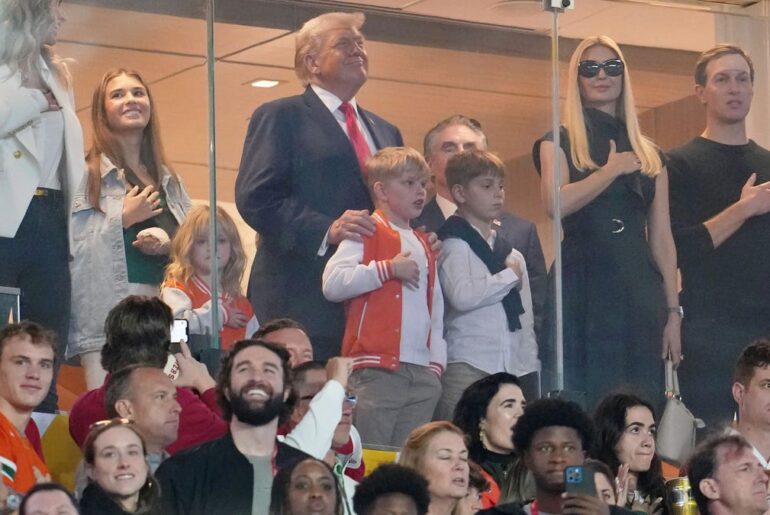 Who is sitting with Donald Trump at Indiana vs Miami national championship?