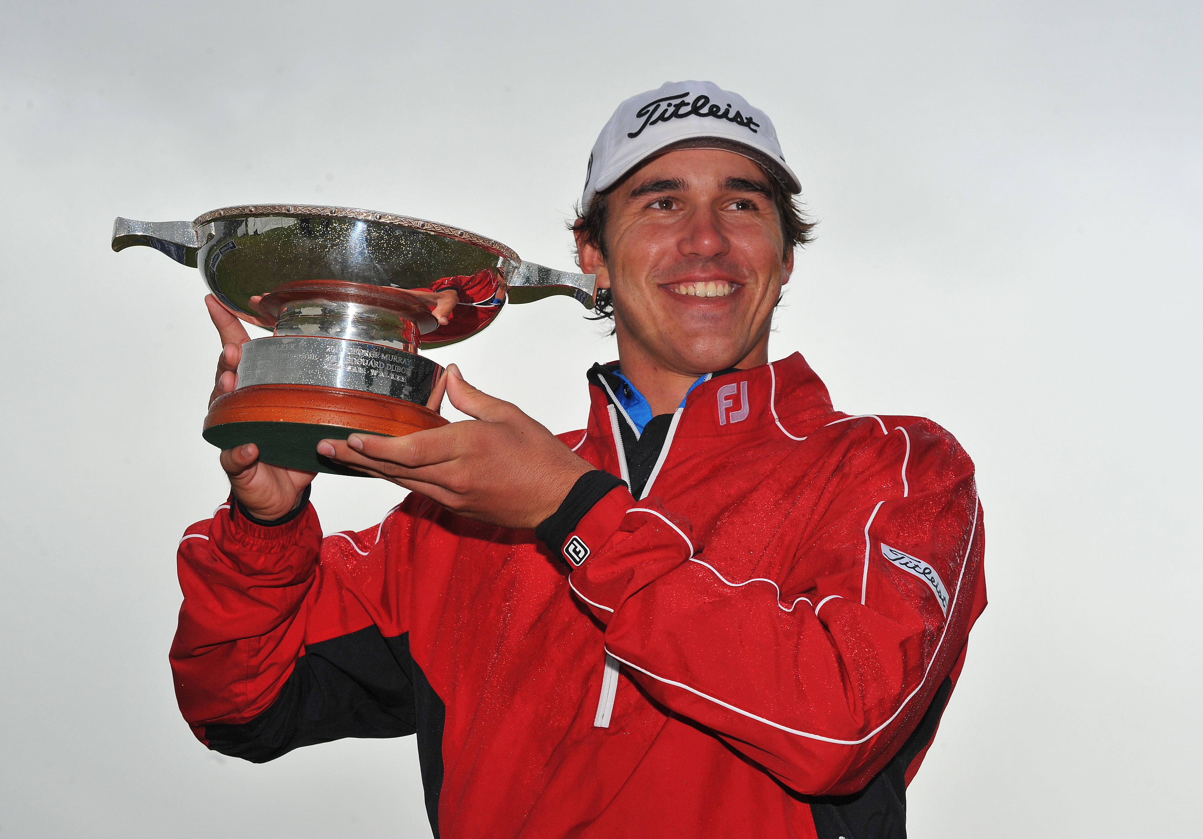 Brooks Koepka holds up the Scottish Hydro Challenge trophy after winning in 2013