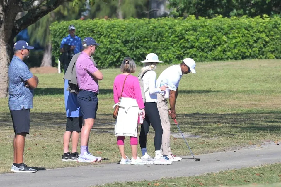 Tiger Woods checks out Charlie Woods’ golf club to make sure it’s okay after it takes a knock against a clump of roots during the Junior Orange Bowl at the Biltmore Golf Course on Jan. 3, 2026. Chet Peterman / Special to The Post / USA TODAY NETWORK via Imagn Images
