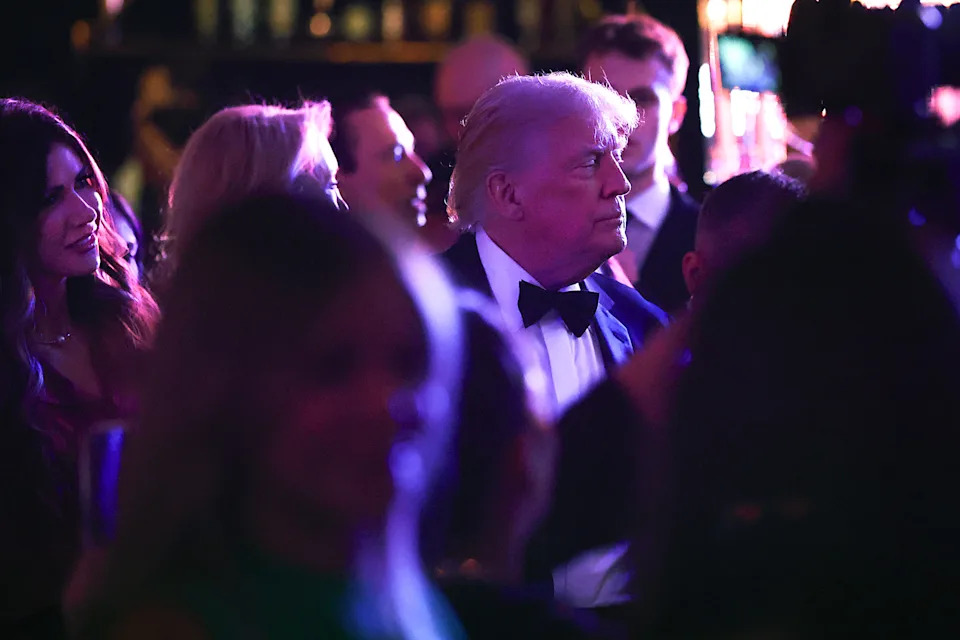 Donald Trump mingles with guests while 