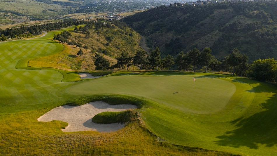 Looking back from the elevated seventh green. Players will need to negotiate the valley located to the left of the fairway (Photo: Kevin Murray)