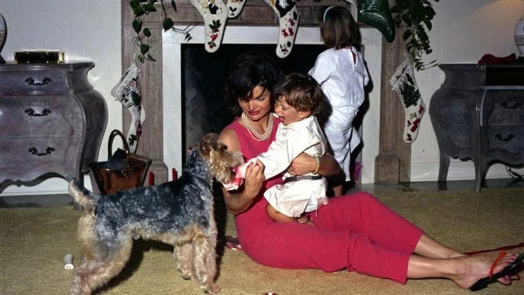 Jackie Kennedy plays with John Jr. and their dog, Charlie, in Palm Beach in 1962. Photo by Cecil Stoughton, White House Photographs, John F. Kennedy Library and Museum, Boston.
