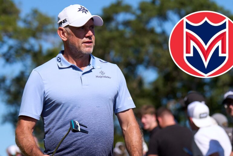 Lee Westwood walks off the green, with a Majesticks GC logo in the corner