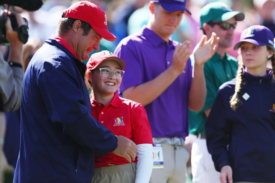 Lily Wachter of St. Augustine is embraced by her father Kevin Wachter after winning the girls 10-11 age group in the 2024 Drive, Chip and Putt National Finals.