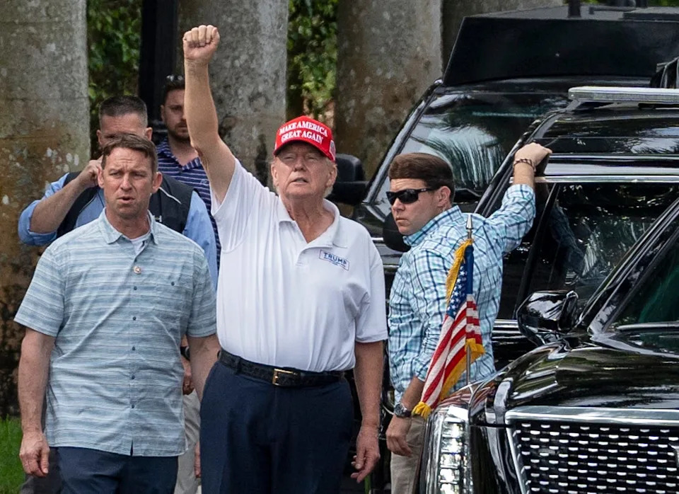 President Donald Trump waves to supporters who gathered across the street from his Trump International Golf Club to celebrate President's Day in West Palm Beach, Florida on February 17, 2025.