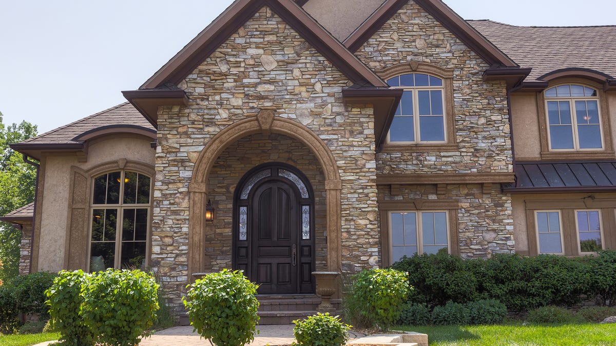 High-end home in Norwalk offers adjacent golf course, big library
