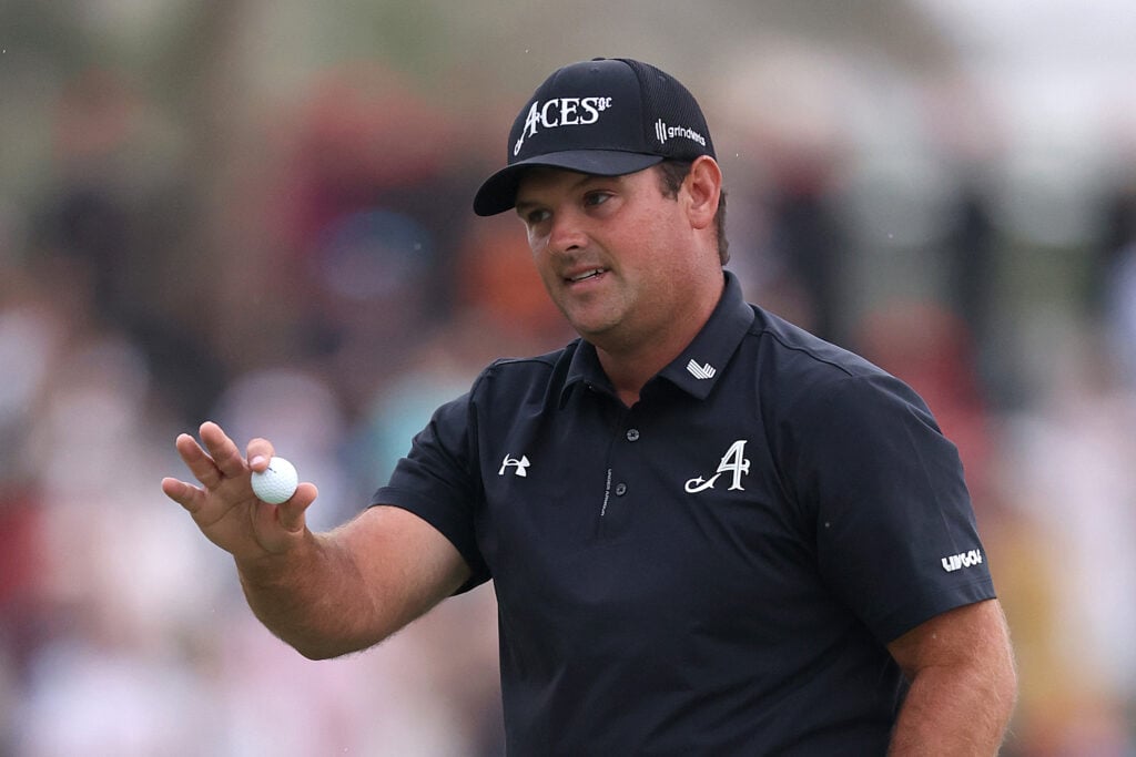Patrick Reed acknowledges the crowd during the final round of the Dubai Desert Classic