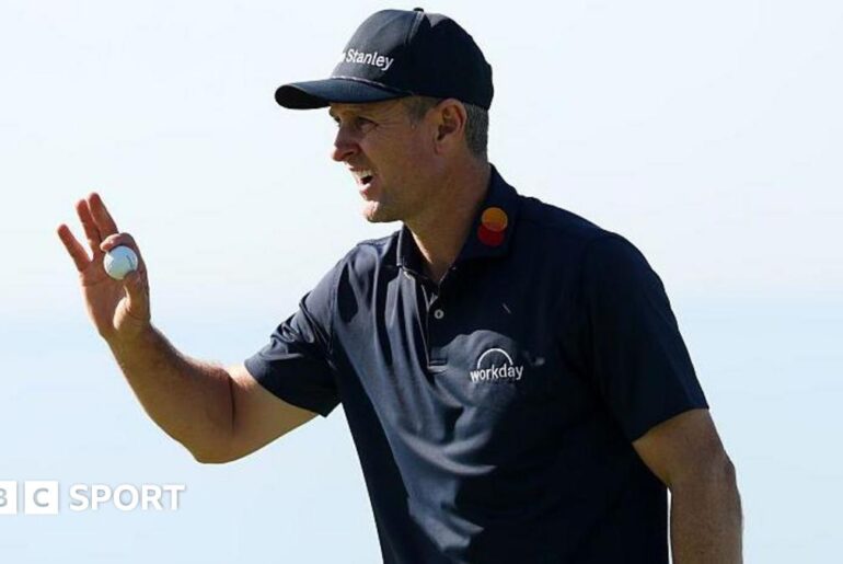 Justin Rose picks up his ball