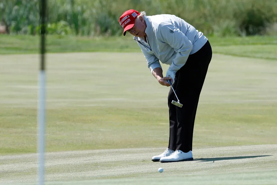 May 25, 2023; Washington, DC, USA; Former President Donald Trump putts on the sixth hole during the Pro-Am tournament as part of the LIV Golf Washington D.C. 2023 event at Trump National Golf Club outside Washington DC. Mandatory Credit: Geoff Burke-USA TODAY Sports