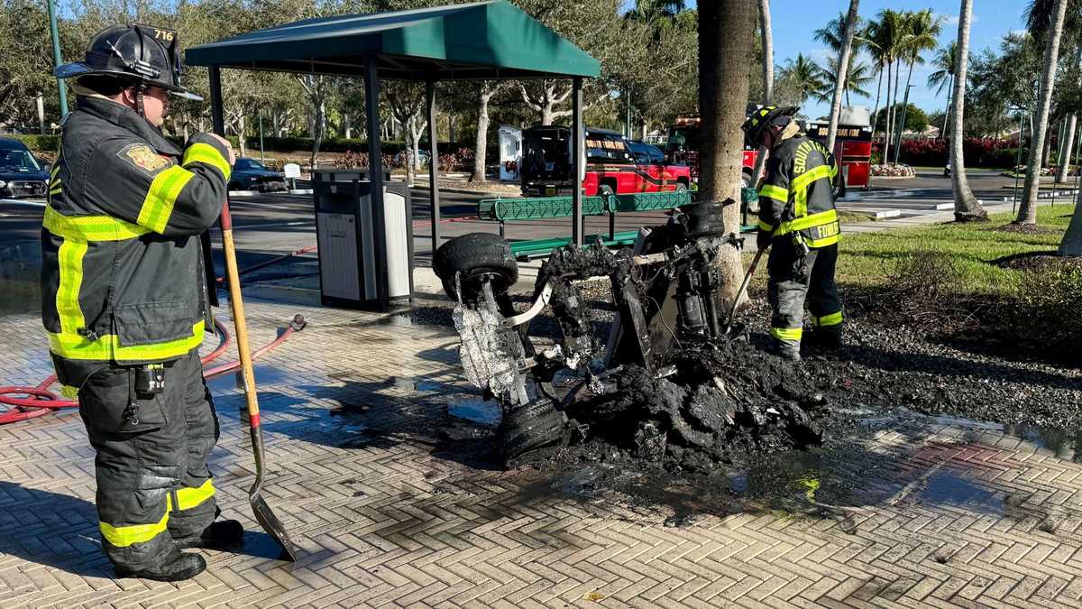 Golf cart engulfed by flames near structure at Legends Golf and Country Club in Lee County