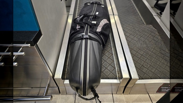 Golf bag on conveyor belt