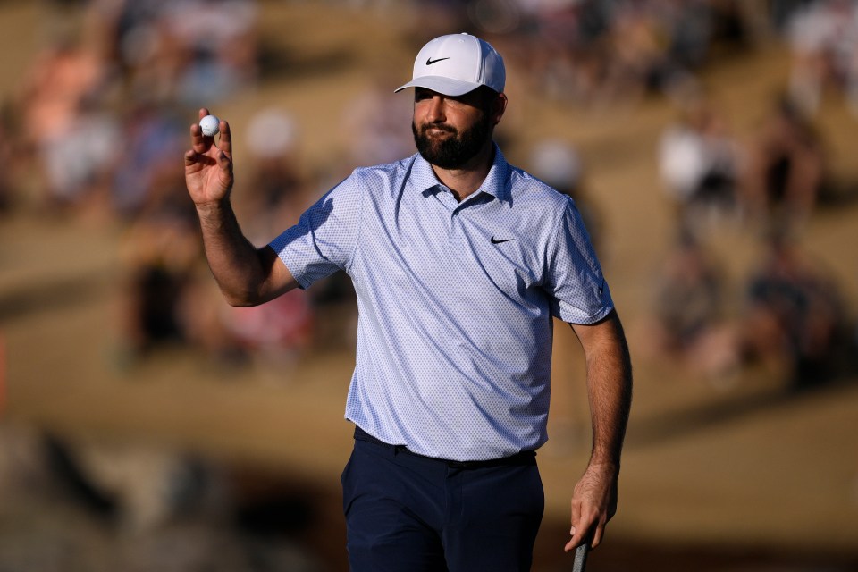 Scottie Scheffler holds his ball to the crowd at The American Express