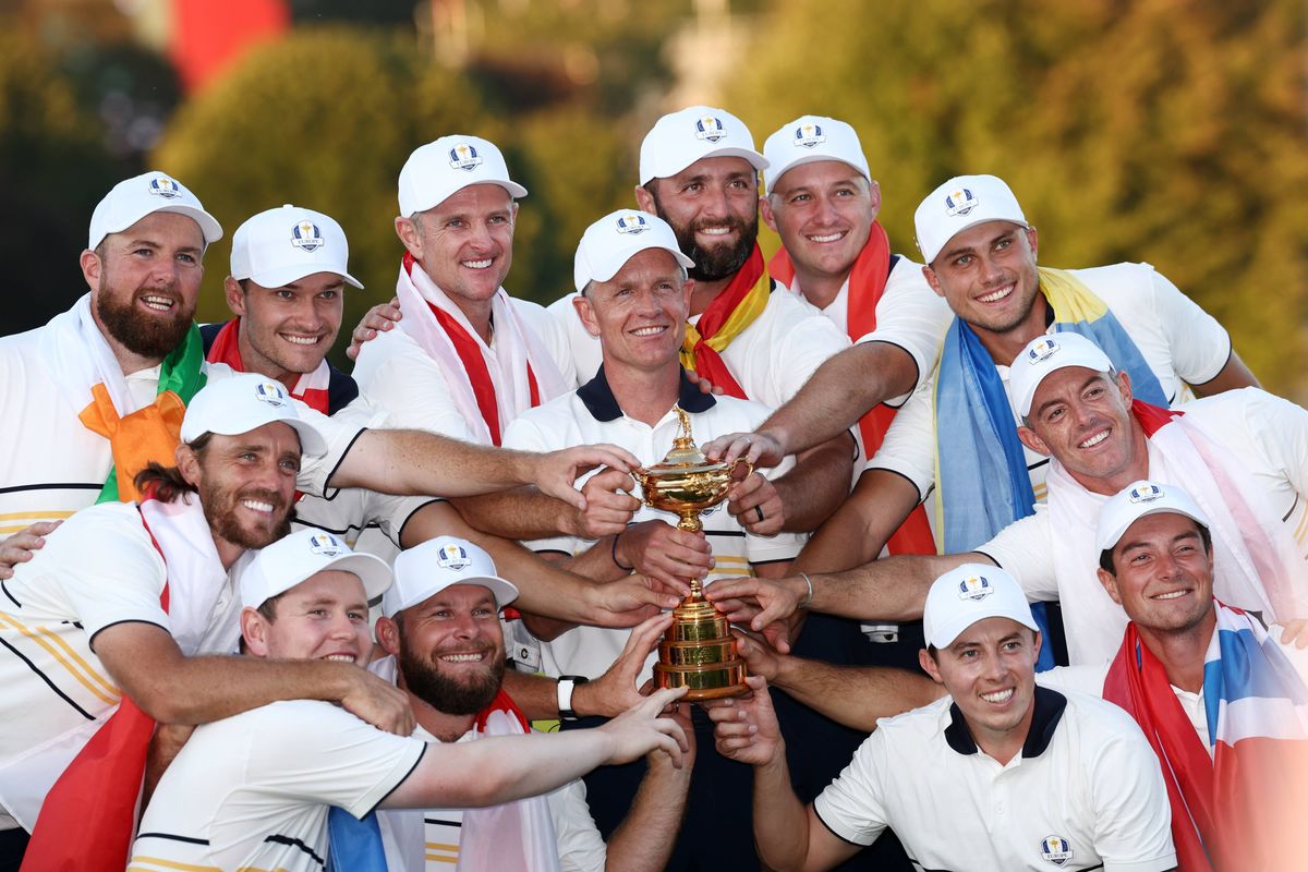 FARMINGDALE, NEW YORK - SEPTEMBER 28: Captain Luke Donald, Shane Lowry, Rasmus Hojgaard, Justin Rose, Jon Rahm, Sepp Straka, Ludvig Aberg, Rory McIlroy, Viktor Hovland, Matt Fitzpatrick, Tommy Fleetwood, Robert MacIntyre and Tyrrell Hatton of Team Europe hold the Ryder Cup trophy after their 15-13 win over Team United States during the Sunday singles matches of the 2025 Ryder Cup at Black Course at Bethpage State Park Golf Course on September 28, 2025 in Farmingdale, New York. (Photo by Jared C. Tilton/Getty Images)