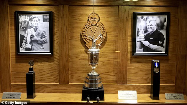 The Claret Jug also takes pride of place next to pictures of Northern Ireland greats, Fred Daly (left) and Clarke (right)