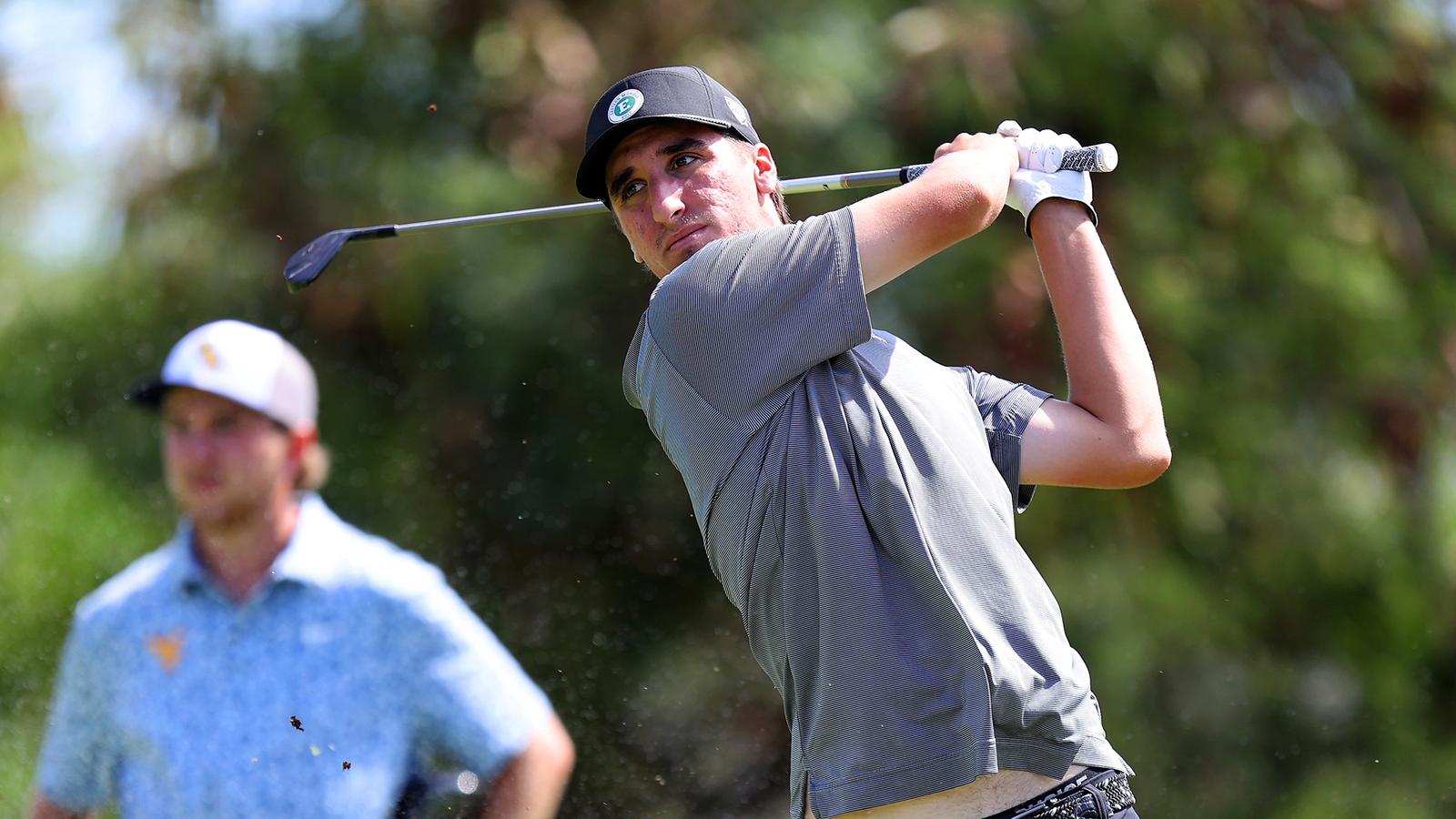 Turnbull Named MAC Golfer of the Week Robby Turnbull takes a swing near the green in Hawaii