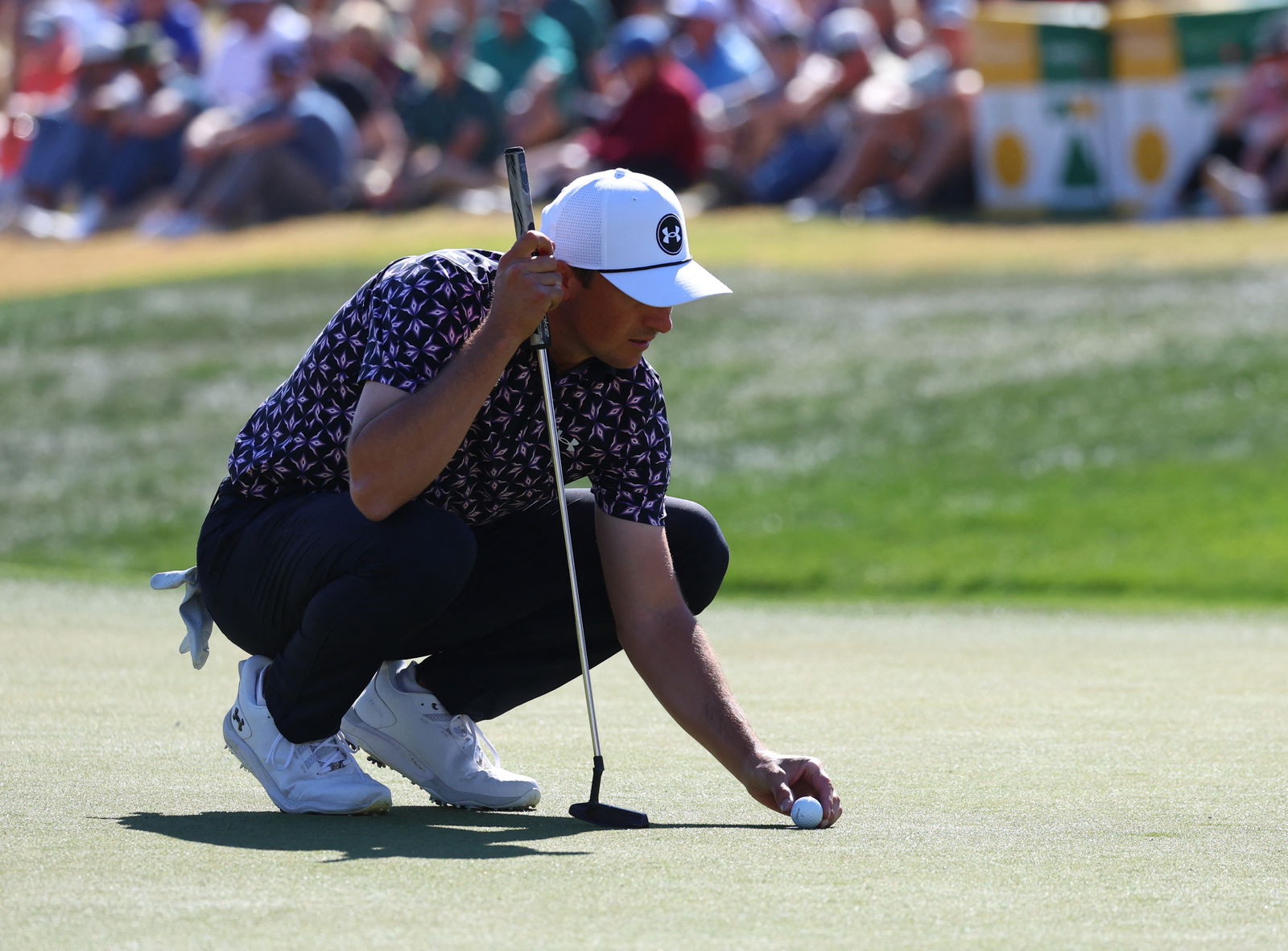 Jordan Spieth of the United States lines up his putt during the second round of the WM Phoenix Open 