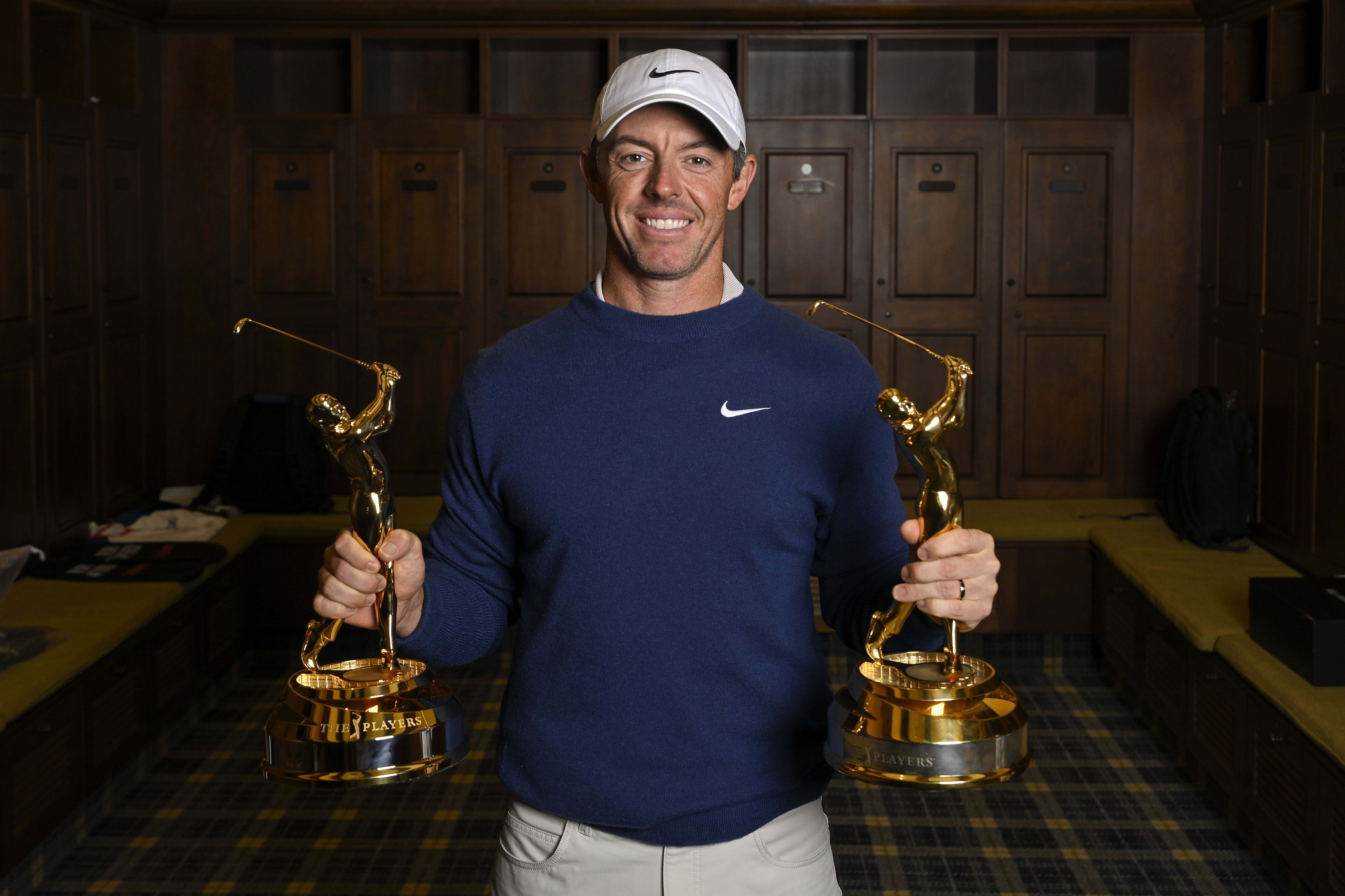 PONTE VEDRA BEACH, FLORIDA - MARCH 17: Rory McIlroy of Northern Ireland poses with the trophy in the champions locker room after defeating J.J. Spaun in a playoff in the final round of THE PLAYERS Championship 2025 at TPC Sawgrass on March 17, 2025 in Ponte Vedra Beach, Florida. (Photo by Ben Jared/PGA TOUR via Getty Images)