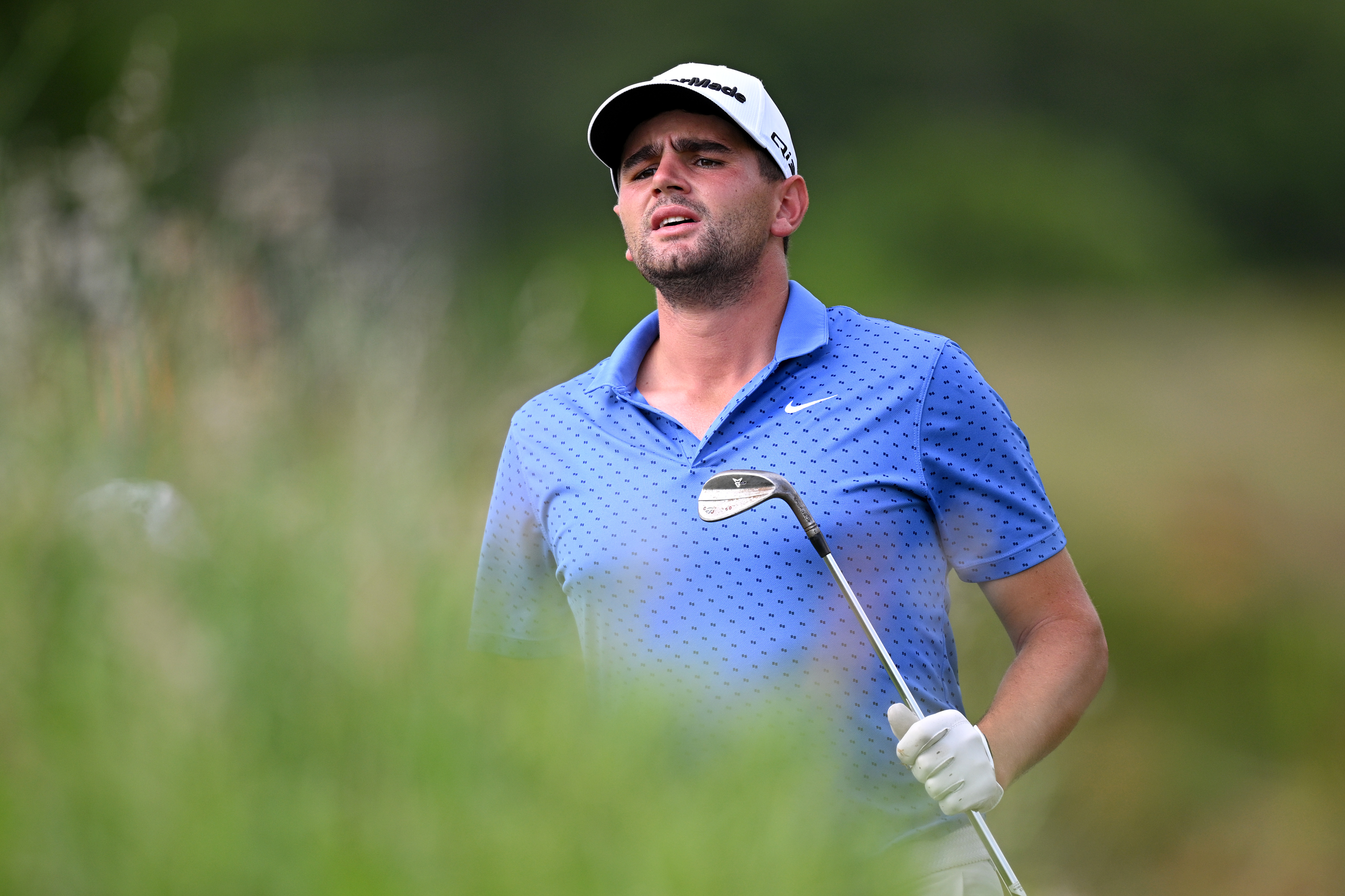 Casey Jarvis watches a wedge shot