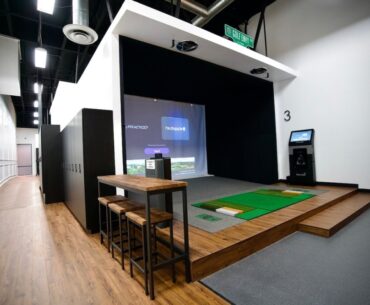 golf simulation bays in a business