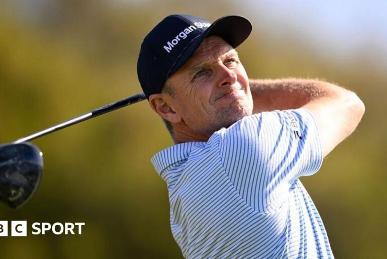 Justin Rose is presented the Championship trophy after winning the Farmers Insurance Open