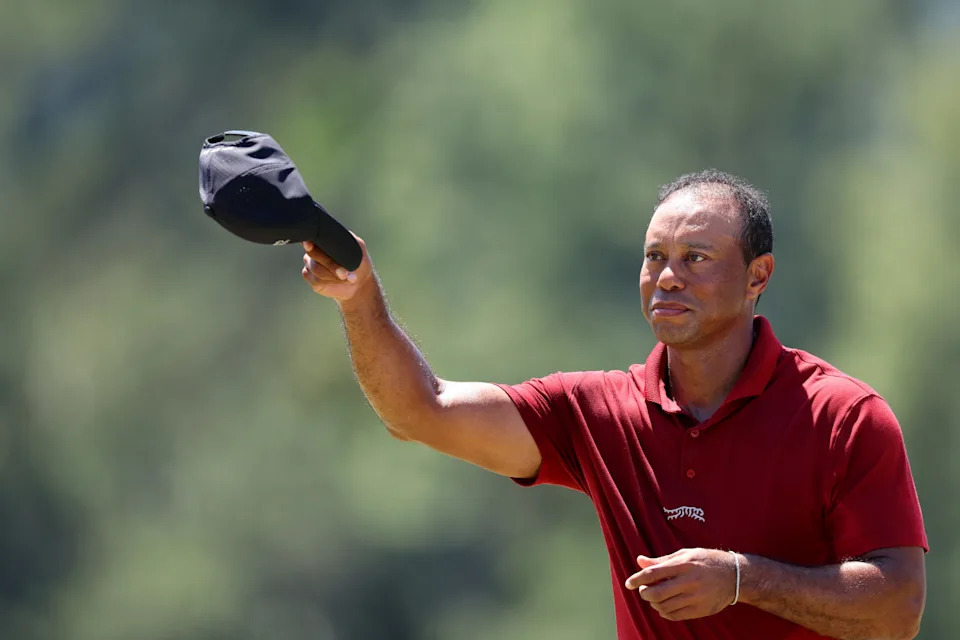 AUGUSTA, GEORGIA - APRIL 14: Tiger Woods of the United States waves his hat to the crowd while walking to the 18th green during the final round of the 2024 Masters Tournament at Augusta National Golf Club on April 14, 2024 in Augusta, Georgia. (Photo by Andrew Redington/Getty Images)Andrew Redington/Getty Images