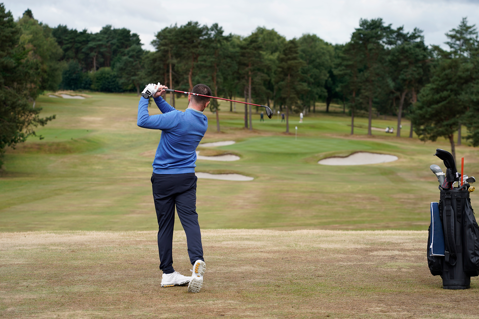 Baz Plummer in the finish position after hitting a 3-wood, with an average distance off around 200 yards