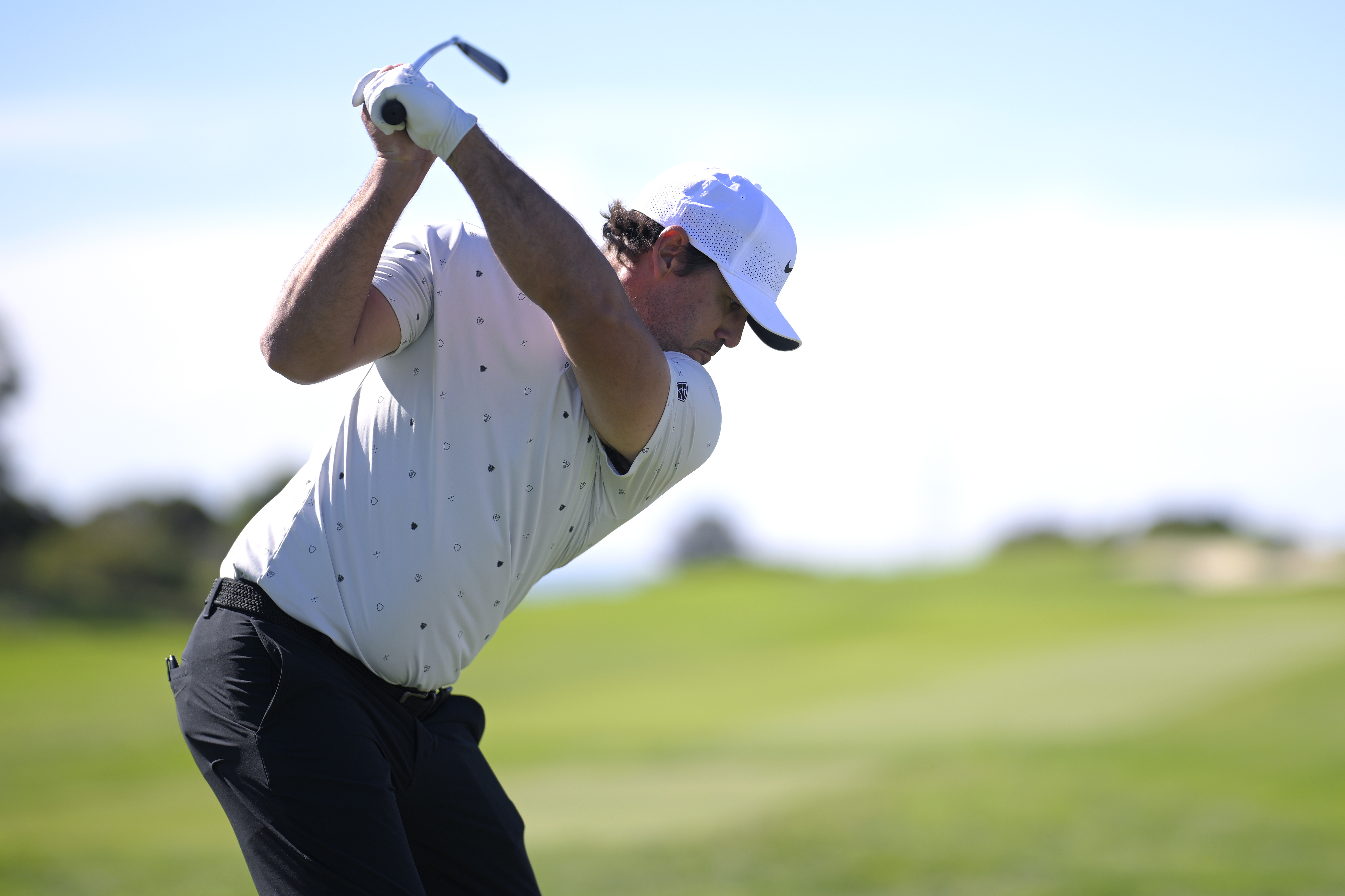 Brooks Koepka at the top of his backswing