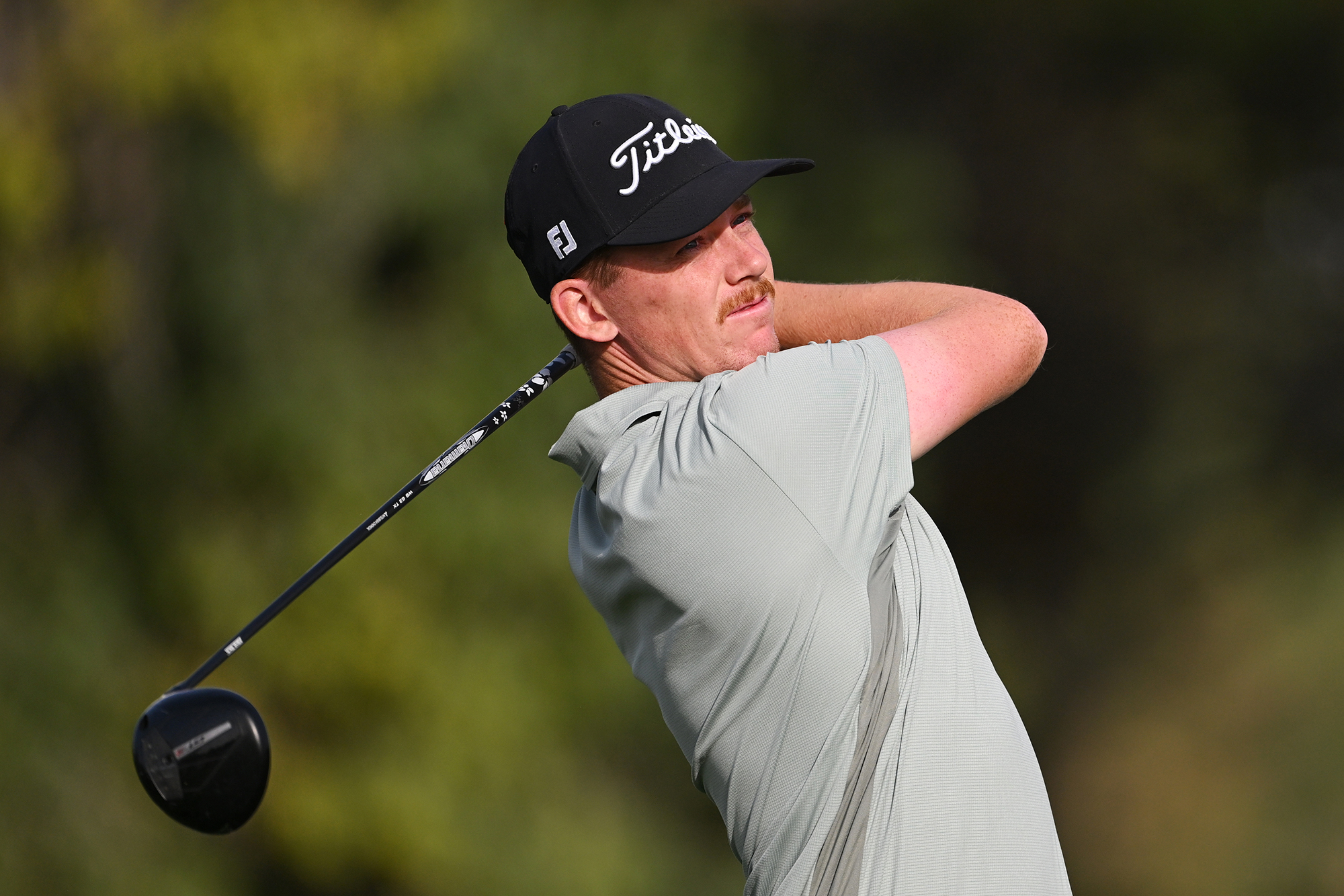 Daniel Hillier in the finish position with driver after hitting a tee shot